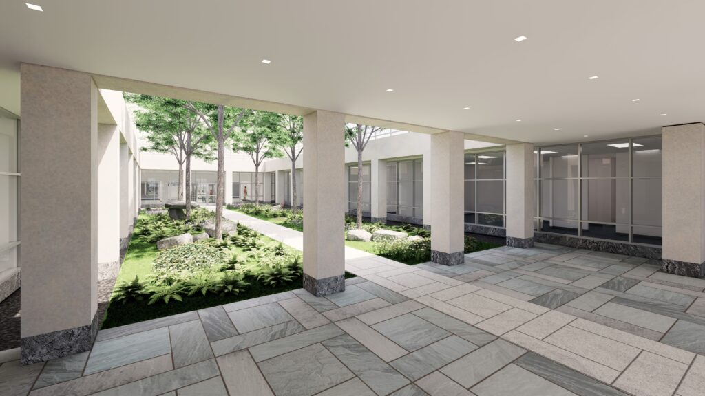 Outdoor courtyard featuring modern architecture, lush greenery, and paved pathways. Designed for relaxation and natural light integration.